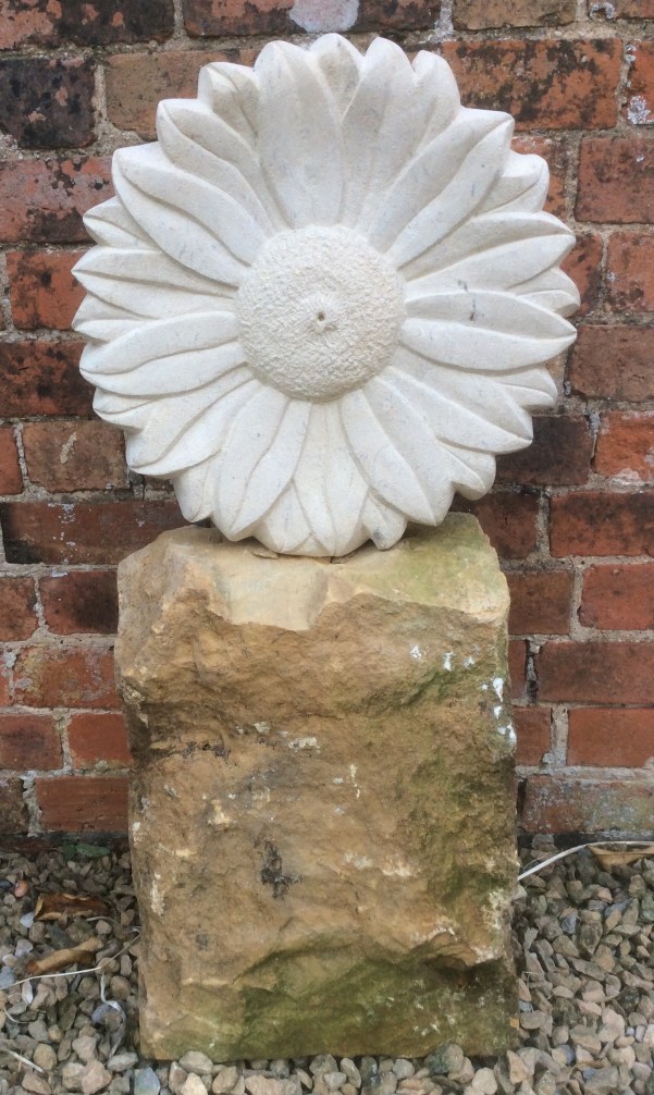 Sculpture of a flower carved in Bath stone