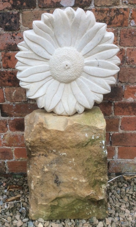 Sculpture of a flower carved in Bath stone