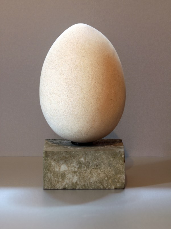 Asymmetry : sculpture of egg carved in Portland stone