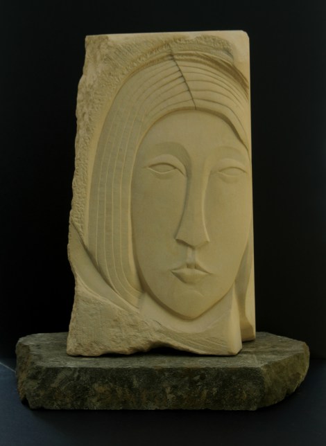 Head carved in Caen Limestone