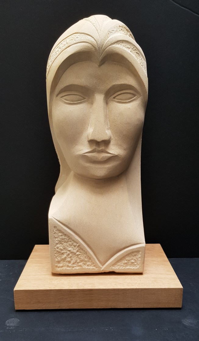 Caen limestone on a green English oak base 